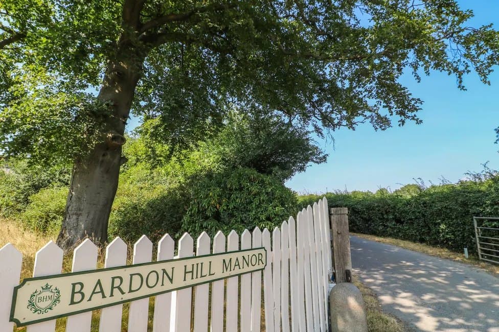 The "Bardon Hill Manor" sign on the gate at the entrance